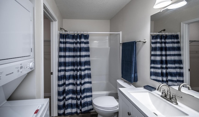 full bathroom featuring toilet, stacked washer and clothes dryer, vanity, shower / tub combo, and a textured ceiling