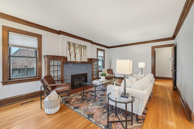 2736 Chowen Ave S, Minneapolis, MN 55416 - living area with crown molding, visible vents, wood finished floors, a fireplace, and baseboards
