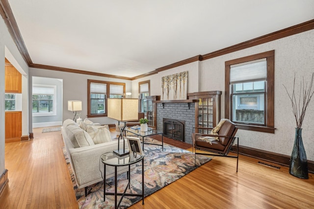 2736 Chowen Ave S, Minneapolis, MN 55416 - living area with baseboards, a brick fireplace, wood finished floors, and visible vents