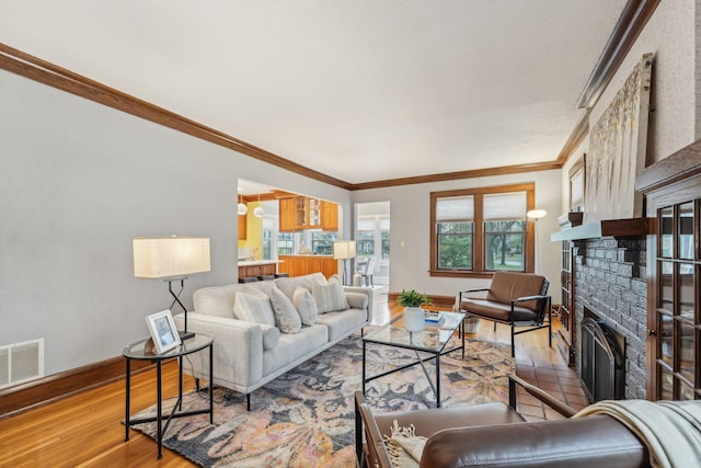 2736 Chowen Ave S, Minneapolis, MN 55416 - living area featuring light wood-style floors, plenty of natural light, a brick fireplace, and visible vents