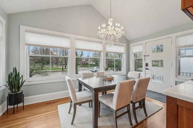 2736 Chowen Ave S, Minneapolis, MN 55416 - dining space with a chandelier, vaulted ceiling, visible vents, and light wood-type flooring