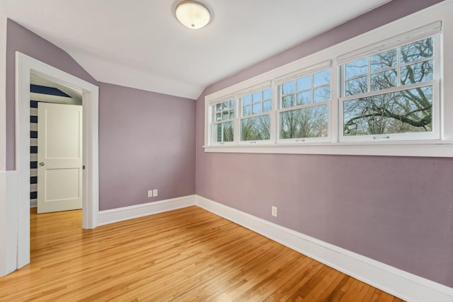 2736 Chowen Ave S, Minneapolis, MN 55416 - empty room with baseboards, vaulted ceiling, and light wood-type flooring