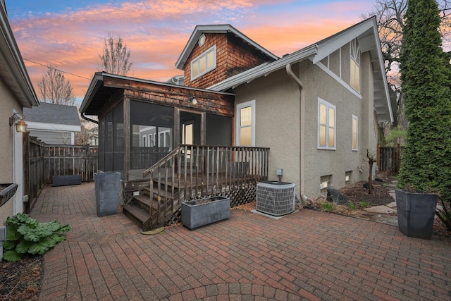 2736 Chowen Ave S, Minneapolis, MN 55416 - back of house with fence, central AC, stucco siding, a sunroom, and a patio area