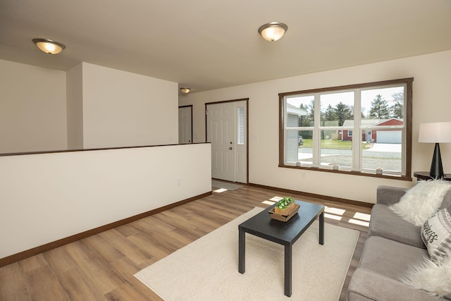 231 Julia St, Claremont, MN 55924 - living area featuring wood finished floors and baseboards