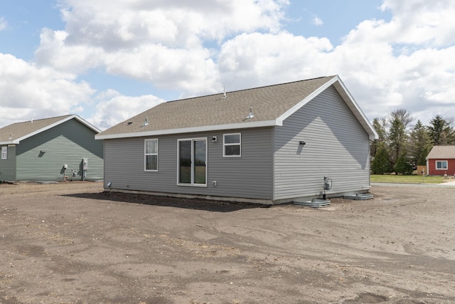 231 Julia St, Claremont, MN 55924 - rear view of house featuring roof with shingles