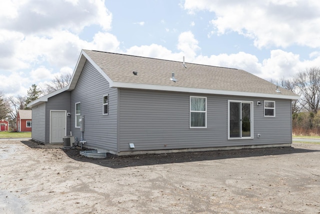 231 Julia St, Claremont, MN 55924 - rear view of property with central AC unit and a shingled roof