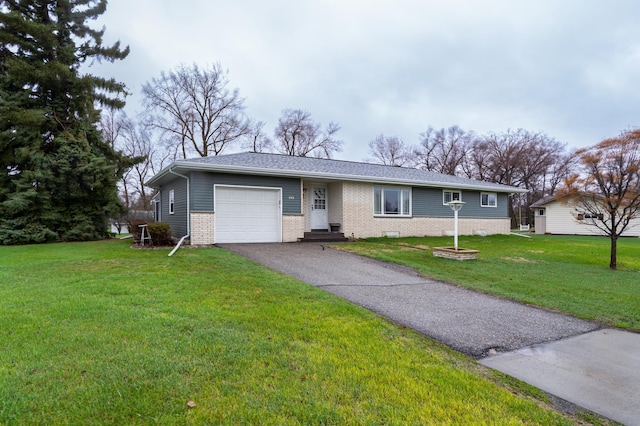 1001 Alexander St, Crookston, MN 56716 - single story home featuring a garage, aphalt driveway, a front yard, roof with shingles, and brick siding