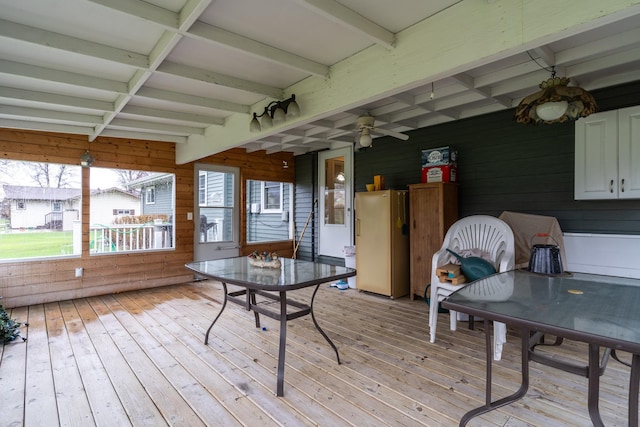 1001 Alexander St, Crookston, MN 56716 - sunroom featuring outdoor dining area, ceiling fan, and beam ceiling