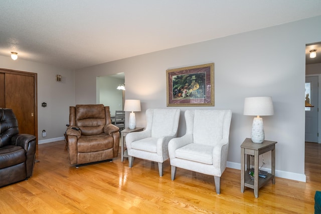 1001 Alexander St, Crookston, MN 56716 - living area with baseboards and light wood-type flooring