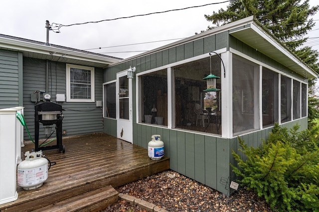 1001 Alexander St, Crookston, MN 56716 - exterior space with a sunroom and a deck