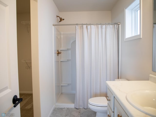 1490 66th Ave S, Fargo, ND 58104 - full bath with vanity, a spacious closet, toilet, and a shower with curtain