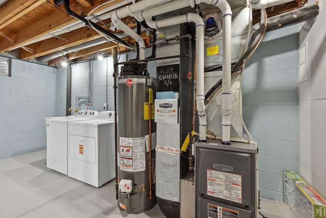 utility room with washer and dryer and gas water heater