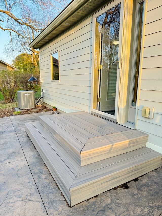 1502 4th Ave SW, Austin, MN 55912 - wooden deck with a patio area and central AC unit