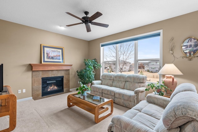 4584 Merganser Dr, Minnetrista, MN 55375 - living area featuring baseboards, a tile fireplace, carpet flooring, and ceiling fan