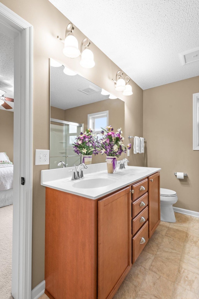 4584 Merganser Dr, Minnetrista, MN 55375 - bathroom with a sink, a textured ceiling, and double vanity