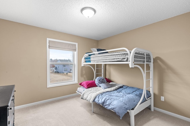 4584 Merganser Dr, Minnetrista, MN 55375 - bedroom featuring baseboards, a textured ceiling, and carpet