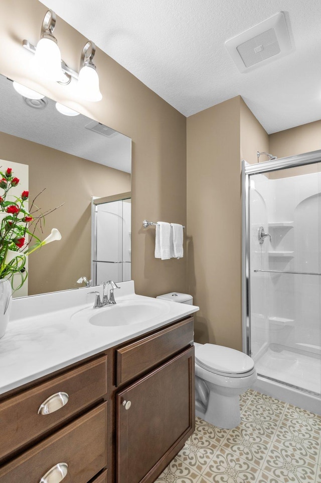 4584 Merganser Dr, Minnetrista, MN 55375 - full bathroom with a stall shower, vanity, toilet, tile patterned flooring, and visible vents