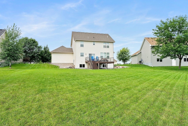 4584 Merganser Dr, Minnetrista, MN 55375 - back of property with a lawn, stairway, and a deck