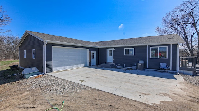 41634 Long Lake Rd, Ottertail, MN 56571 - ranch-style house with a garage, driveway, central air condition unit, and roof with shingles