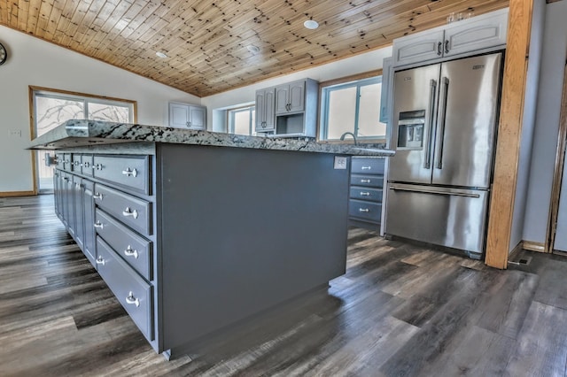 41634 Long Lake Rd, Ottertail, MN 56571 - kitchen featuring stainless steel refrigerator with ice dispenser, gray cabinetry, healthy amount of natural light, wooden ceiling, and lofted ceiling
