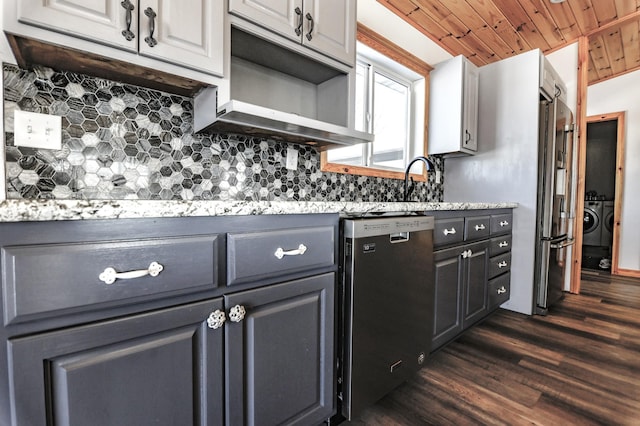 41634 Long Lake Rd, Ottertail, MN 56571 - kitchen featuring stainless steel dishwasher, washer and dryer, dark wood finished floors, decorative backsplash, and wood ceiling