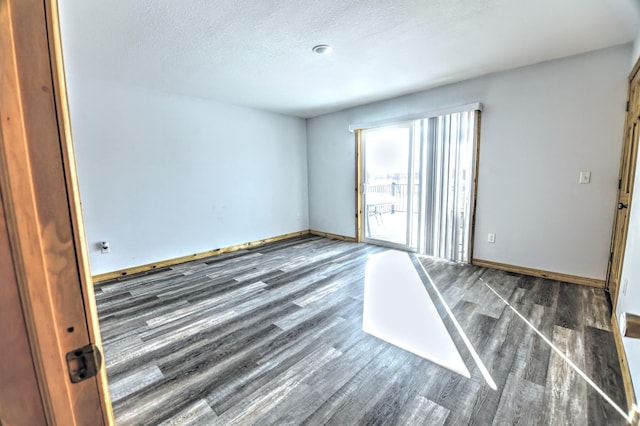 41634 Long Lake Rd, Ottertail, MN 56571 - unfurnished room featuring wood finished floors, a textured ceiling, and baseboards