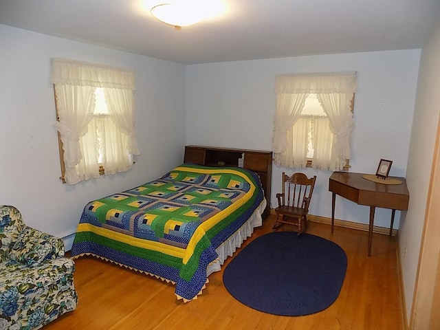 bedroom featuring wood finished floors