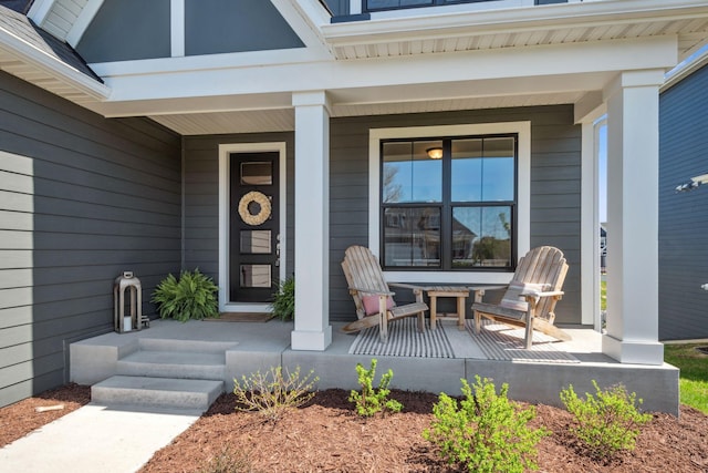 entrance to property featuring a porch