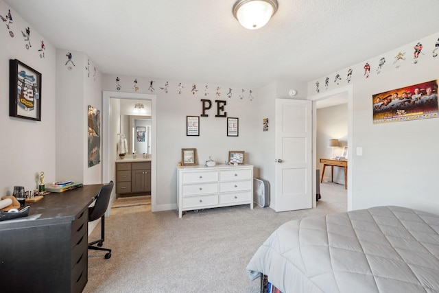 bedroom with light carpet and ensuite bath