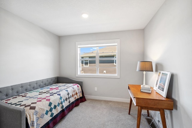 carpeted bedroom with baseboards