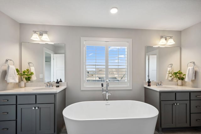 10683 40th St N, Lake Elmo, MN 55042 - bathroom featuring a freestanding bath and two vanities