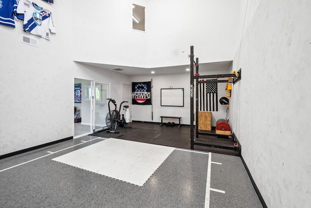 10683 40th St N, Lake Elmo, MN 55042 - workout room featuring baseboards and a high ceiling
