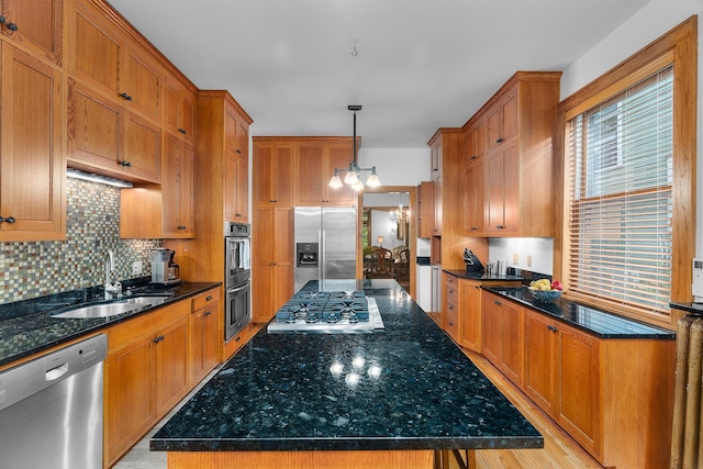 904 Lincoln Ave, Saint Paul, MN 55105 - kitchen with stainless steel appliances, tasteful backsplash, a center island, a chandelier, and dark stone counters