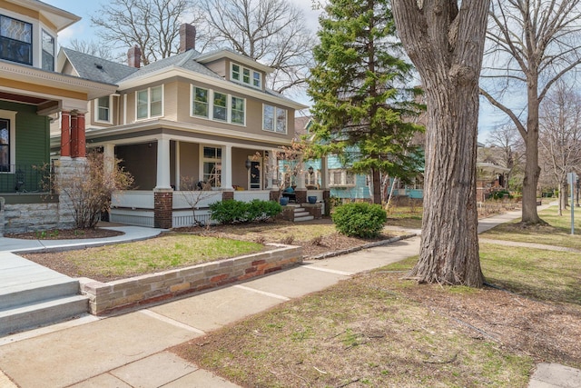 904 Lincoln Ave, Saint Paul, MN 55105 - traditional style home with a porch and a chimney