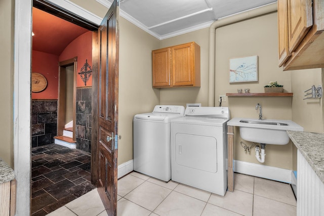 904 Lincoln Ave, Saint Paul, MN 55105 - laundry area with cabinet space, separate washer and dryer, and ornamental molding