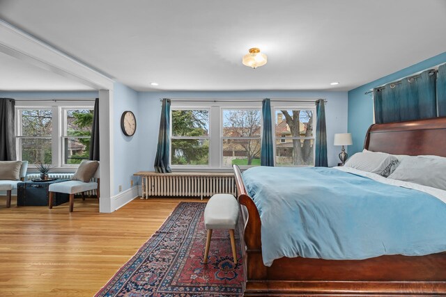 904 Lincoln Ave, Saint Paul, MN 55105 - bedroom with radiator heating unit, multiple windows, light wood-type flooring, and recessed lighting
