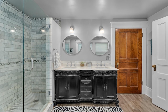 904 Lincoln Ave, Saint Paul, MN 55105 - full bath with a stall shower, double vanity, and wood finished floors