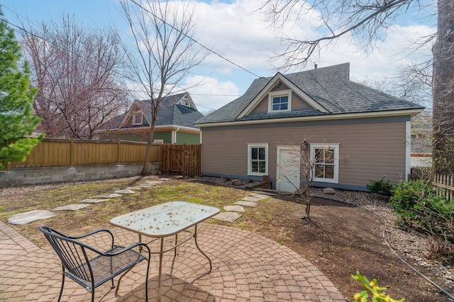 904 Lincoln Ave, Saint Paul, MN 55105 - back of house featuring a patio area, a fenced backyard, and roof with shingles