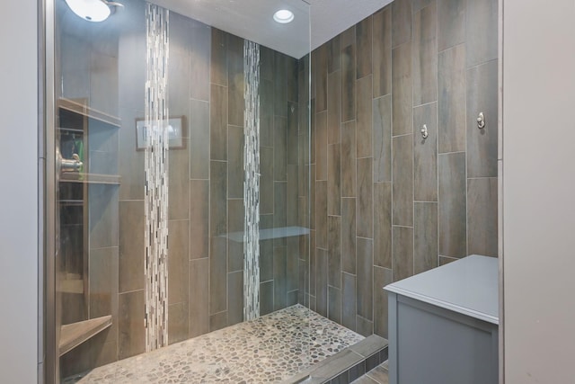 bathroom with recessed lighting and walk in shower