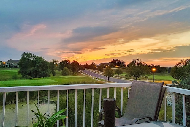 view of balcony at dusk
