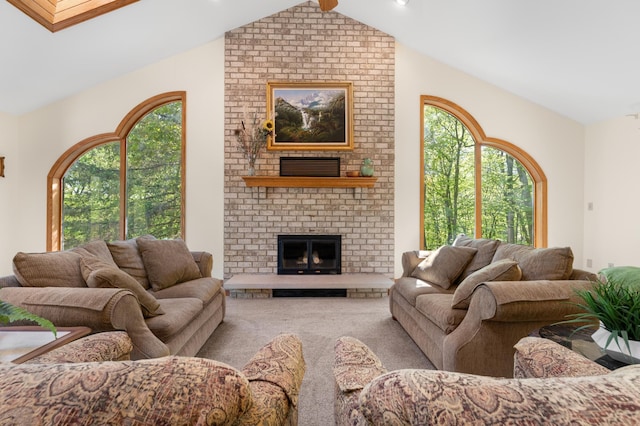 living area with vaulted ceiling, carpet, and a brick fireplace