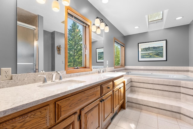 bathroom featuring a skylight, tile patterned floors, a bath, double vanity, and an enclosed shower