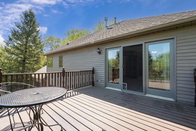 wooden terrace with outdoor dining space