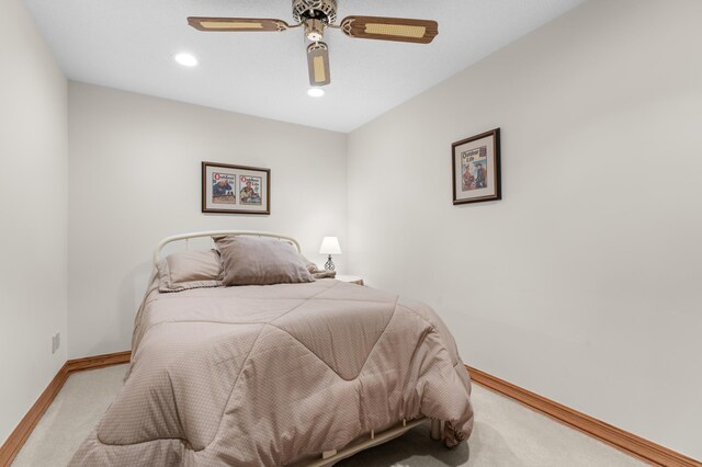 bedroom with light colored carpet, baseboards, a ceiling fan, and recessed lighting