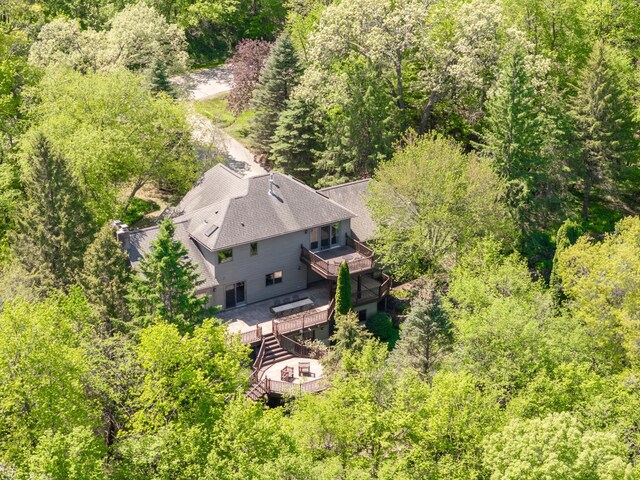 view of subject property featuring a forest