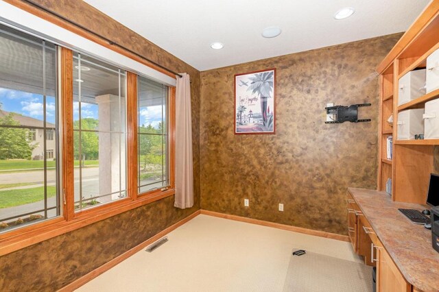 unfurnished office featuring recessed lighting, wallpapered walls, visible vents, and baseboards