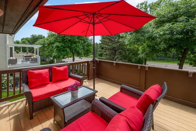 wooden deck with an outdoor hangout area