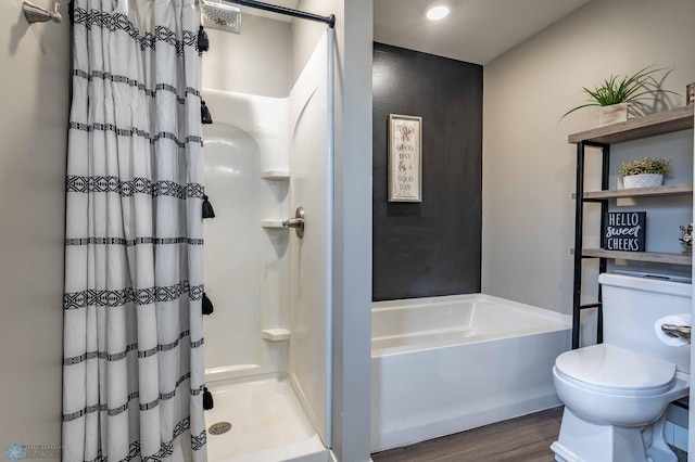 full bath with a bath, toilet, wood finished floors, and a shower with shower curtain