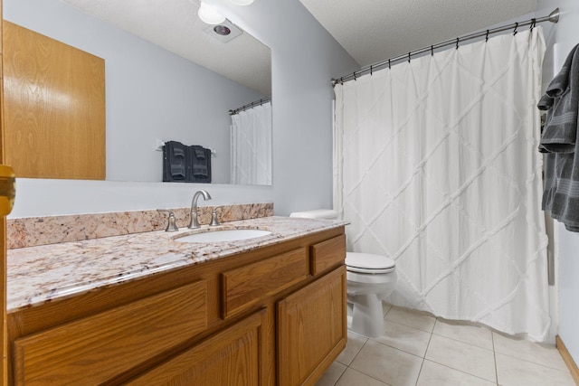full bath featuring toilet, tile patterned flooring, vanity, and a textured ceiling