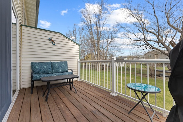 wooden terrace with a yard